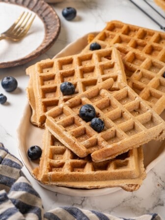Platter of protein waffles topped with blueberries